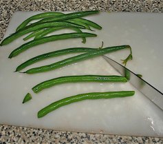 Step 1: Prepare the beans as shown if they are stringless, otherwise you must also remove the stri…