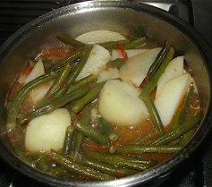 Step 6: The watery sauce will reduce while cooking and the beans will change colour and not be a b…