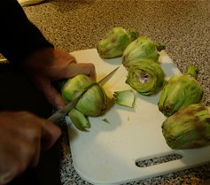 Step 4: The second part of preparing the artichokes is to cut off the bottom part of the leaves to…